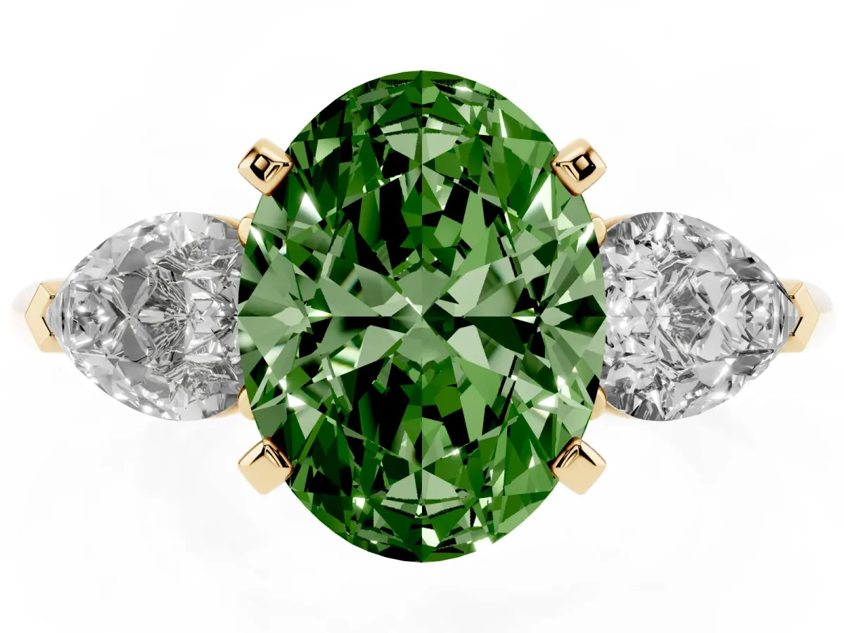 Fancy Green Three-Stone Oval Cut Diamond Ring with Pear Side Stones and Four-Prong Setting Yellow gold