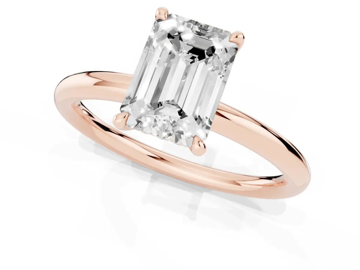 Emerald Cut Diamond Solitaire Ring with Thin Band and Four-Prong Setting Rose gold