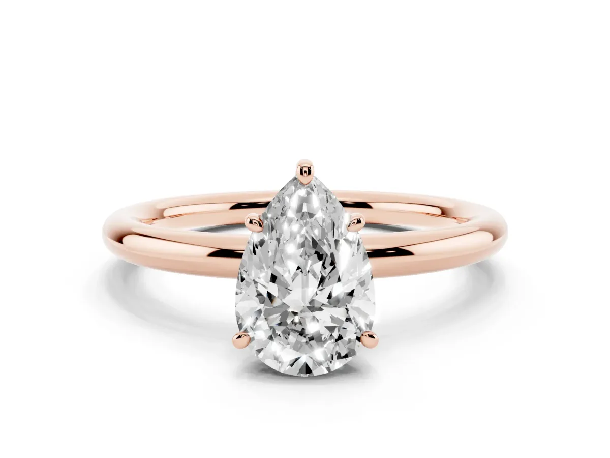 Pear Cut Solitaire Diamond Ring with Four-Prong Setting on a Plain Band Rose gold