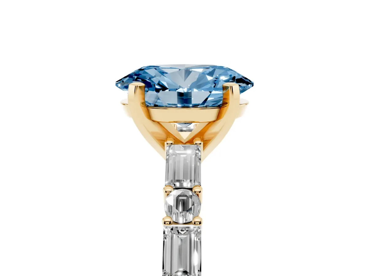 Fancy Blue Oval Cut Diamond Solitaire with Side Baguettes and Channel Set Band Yellow gold