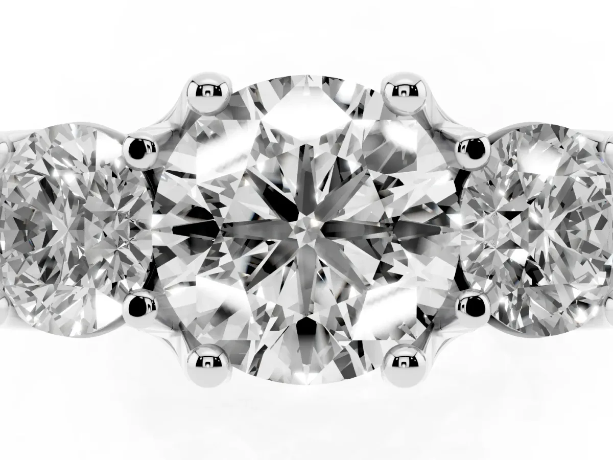 Round Cut Diamond Three-Stone Ring with Channel Set Band and Four-Prong Setting Silver