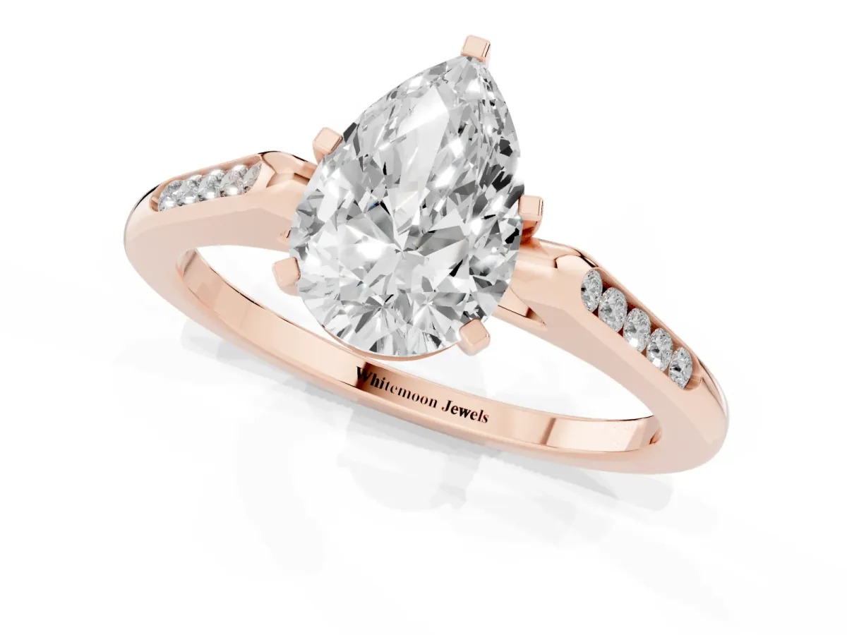 Pear Cut Diamond Solitaire Ring with Channel Set Round Band and Prong Setting Rose gold
