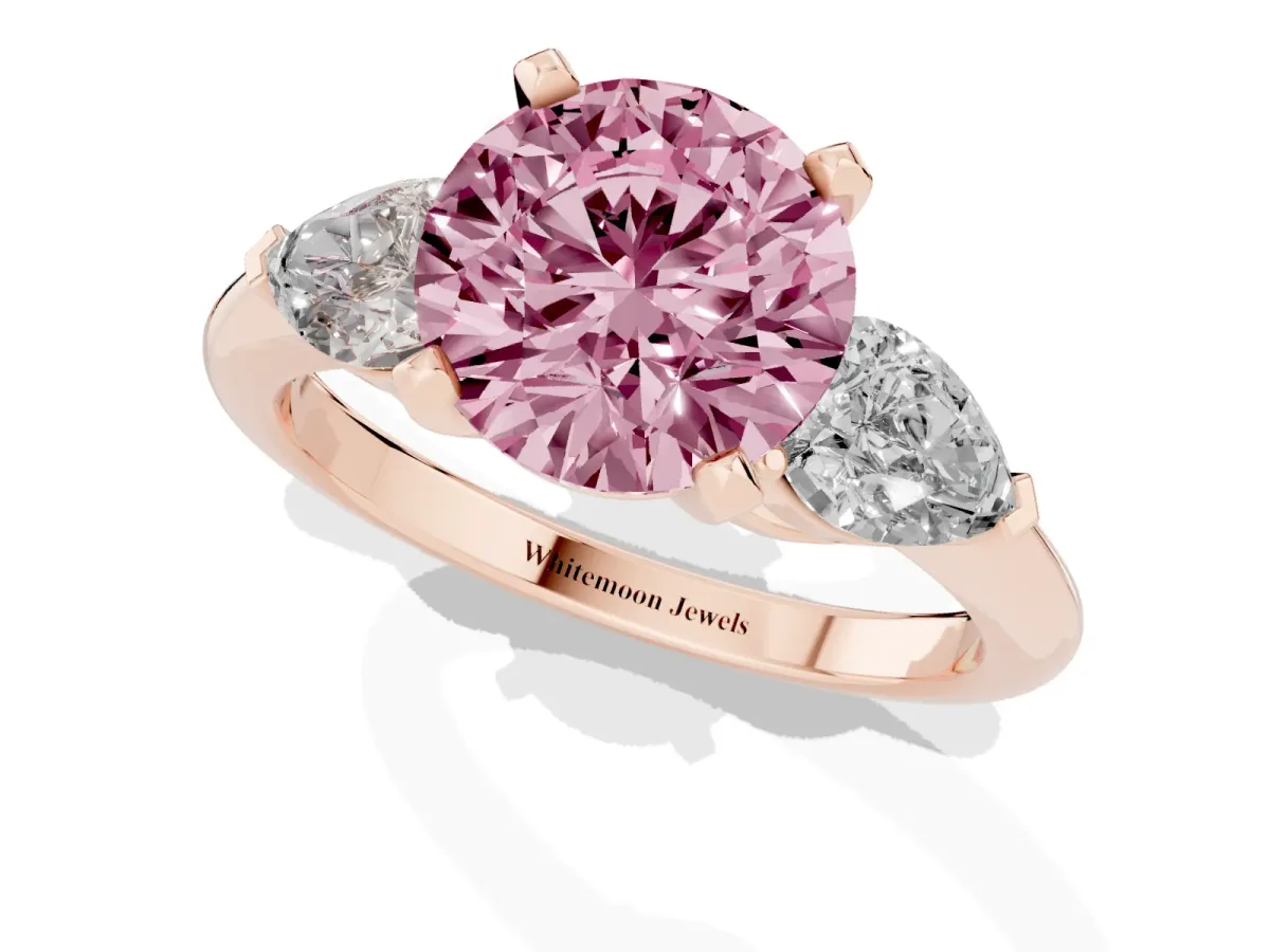 Fancy Pink Three-Stone Round Cut Diamond Ring with Pear Side Stones and Four-Prong Setting Rose gold