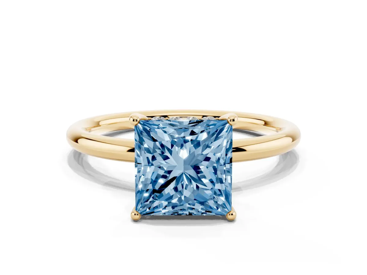 Fancy Blue Princess Cut Solitaire Diamond Ring with a Classic Band and Four-Prong Setting Yellow gold
