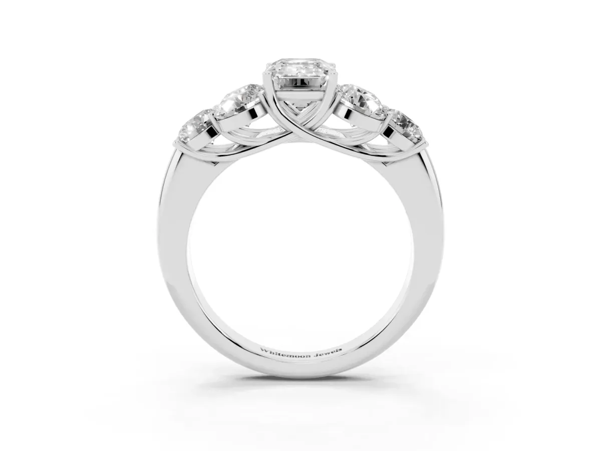 Emerald Cut Cut Diamond Cluster Ring with Round Accent Stones and Prong Setting on a Classic Band Silver