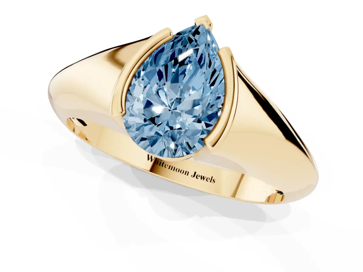 Fancy Blue Pear Cut Solitaire Tension Set Diamond Ring Yellow gold