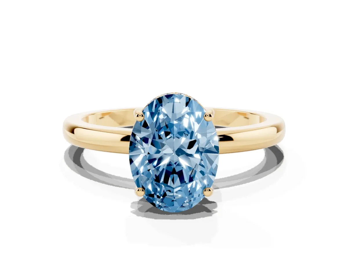 Fancy Blue Oval Cut Solitaire Diamond Ring with Prong Setting and Plain Band Yellow gold