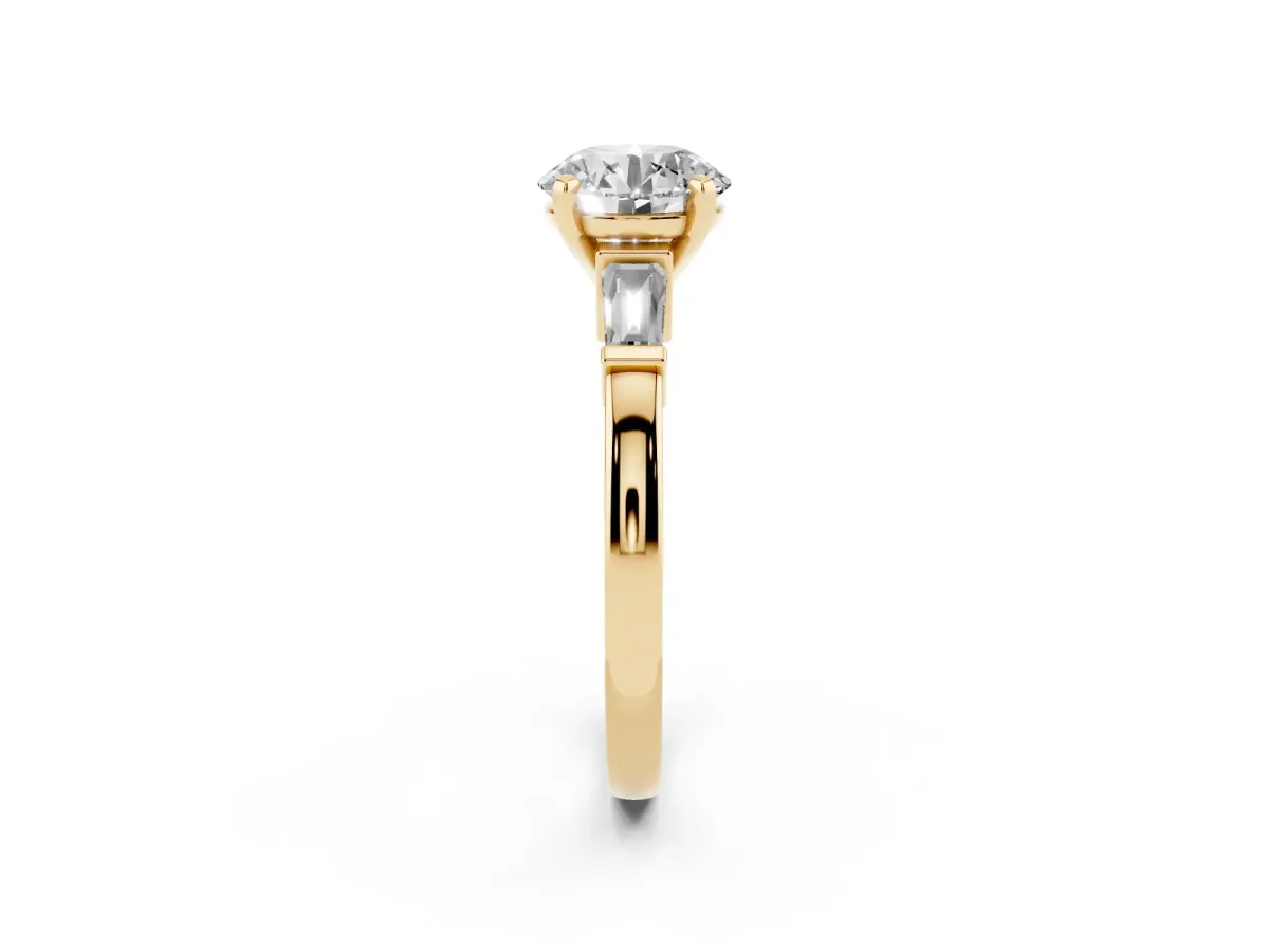 Round Cut Cut Diamond Solitaire Ring with Tapered Baguette Accents and Four-Prong Setting Yellow gold