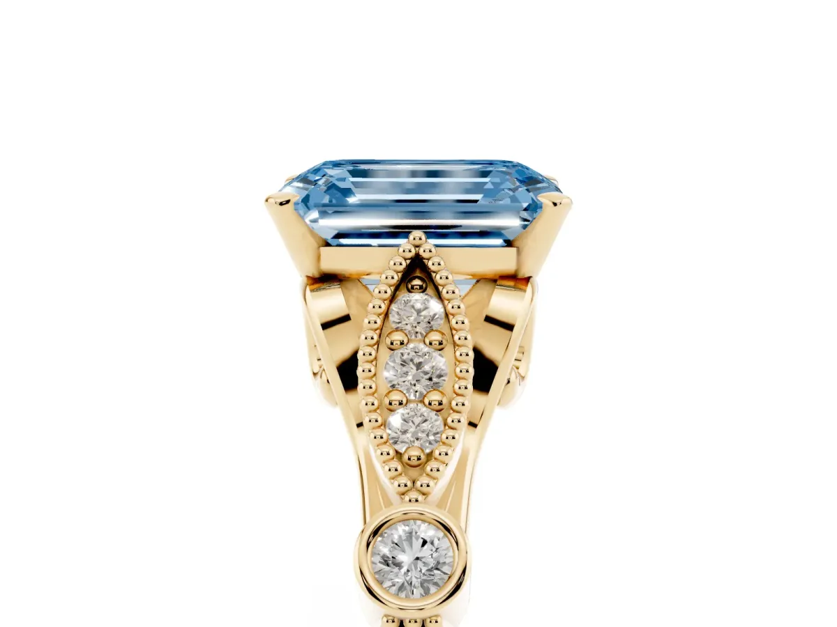 Fancy Blue Emerald Cut Cut Diamond with Milgrain Marquise and Bezel Accents on a Solitaire Band with Prong Setting Yellow gold