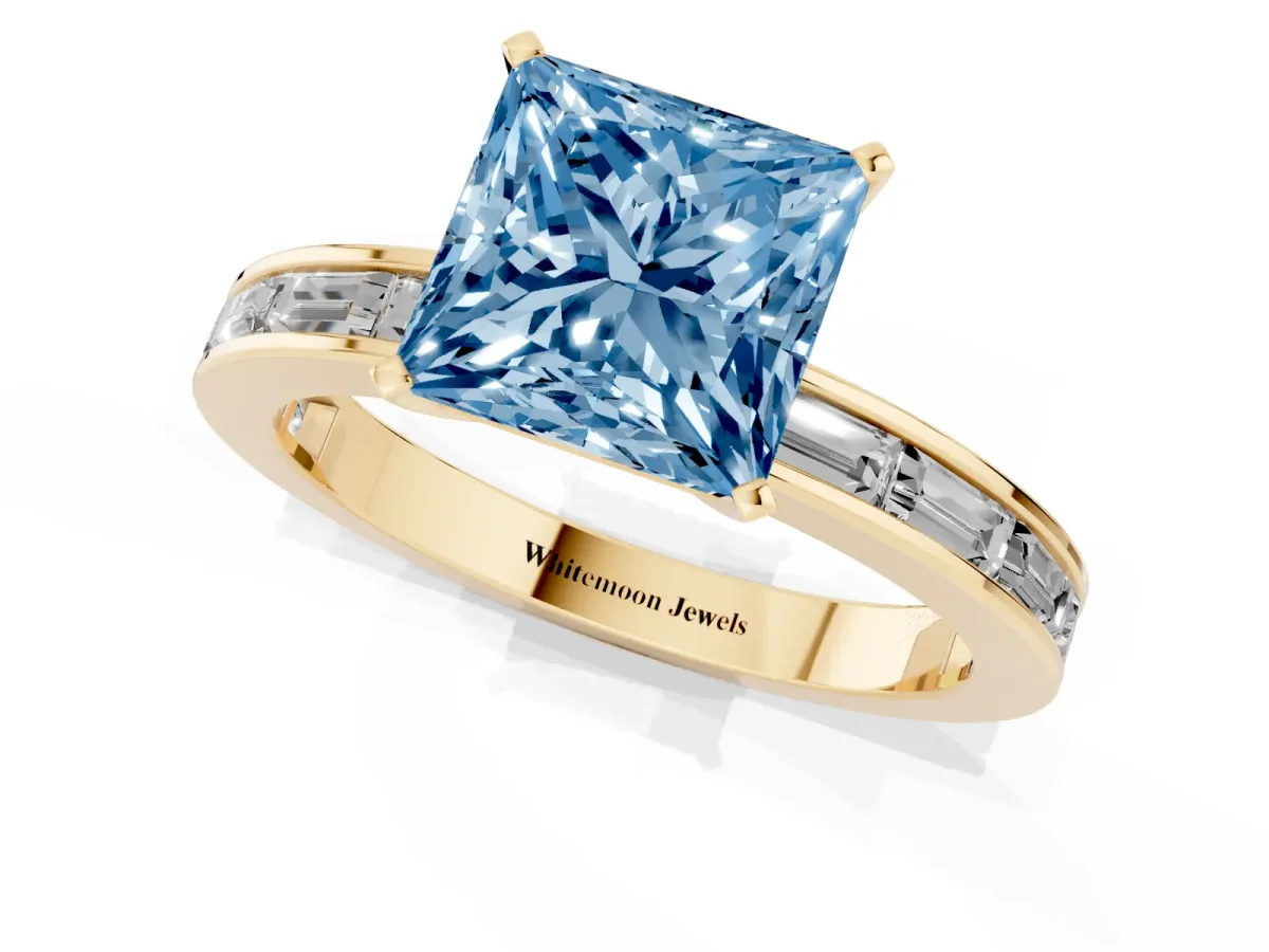 Fancy Blue Princess Cut Solitaire Diamond Ring with Channel-Set Baguette Band and Four-Prong Setting Yellow gold