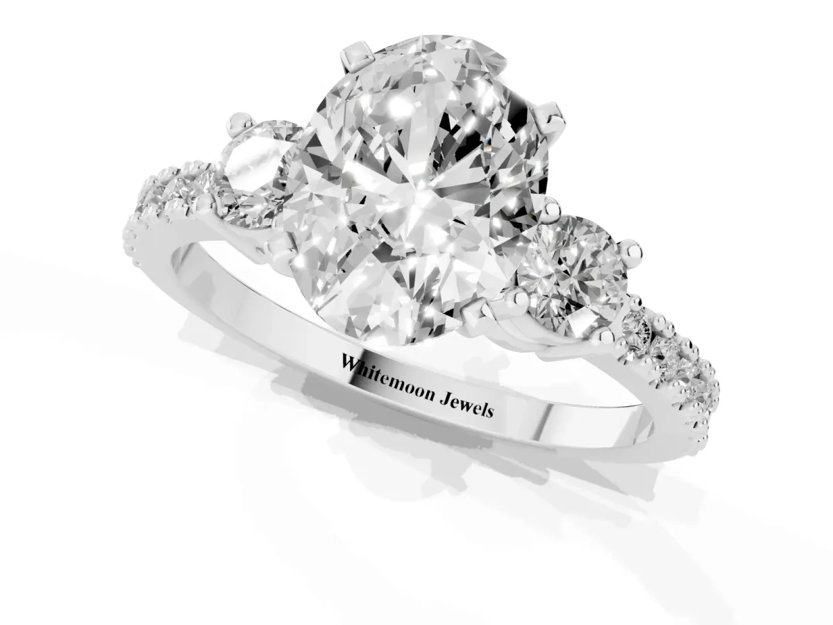 Oval Cut Three-Stone Diamond Pavé Band with Prong Setting Platinum