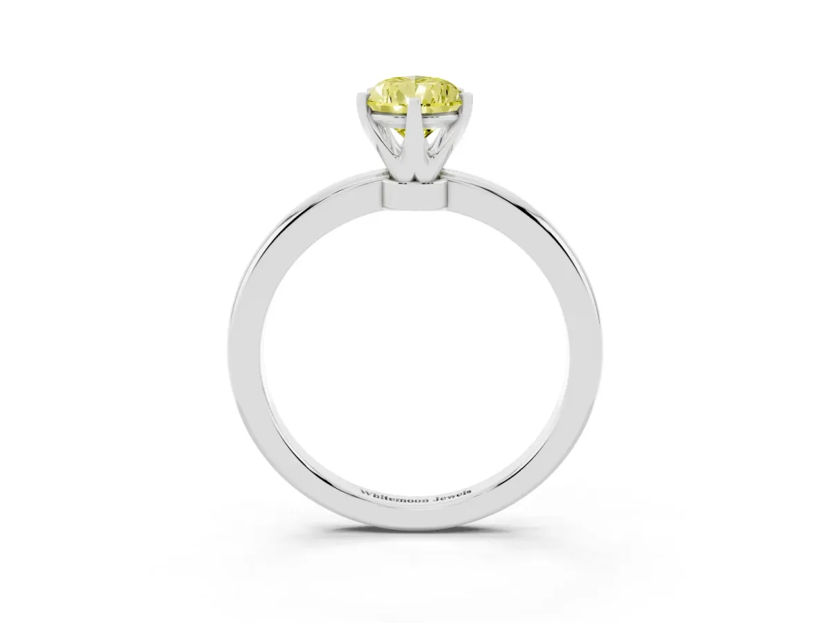 Fancy Yellow Pear Cut Solitaire Diamond Ring with Six-Prong Setting on a Classic Band Silver