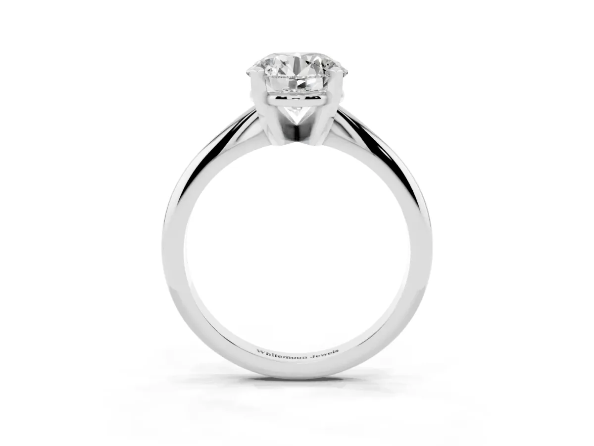 Round Cut Cut Solitaire Ring with Four-Prong Setting on a Classic Band Silver