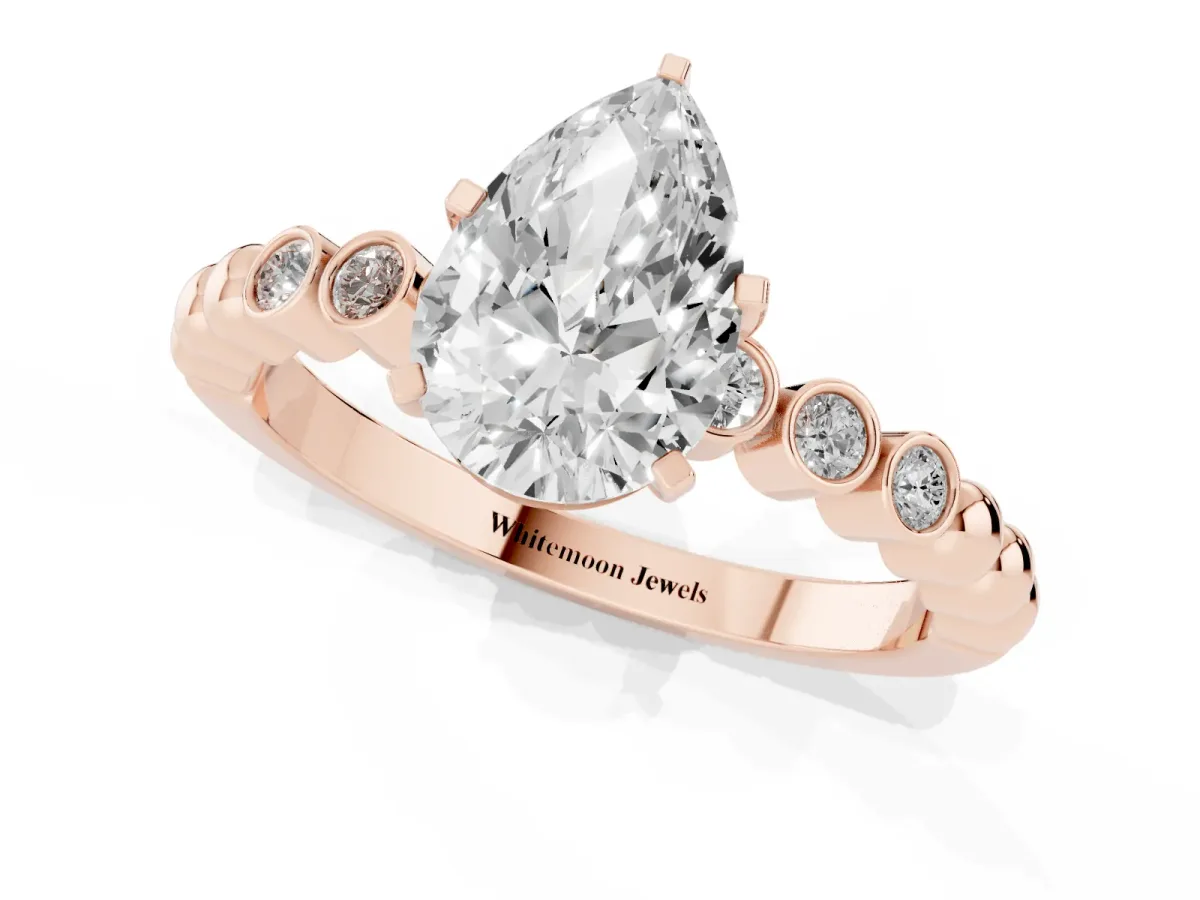 Pear Cut Solitaire Bezel Accent Diamond Engagement Ring with Beaded Band and Four-Prong Setting Rose gold