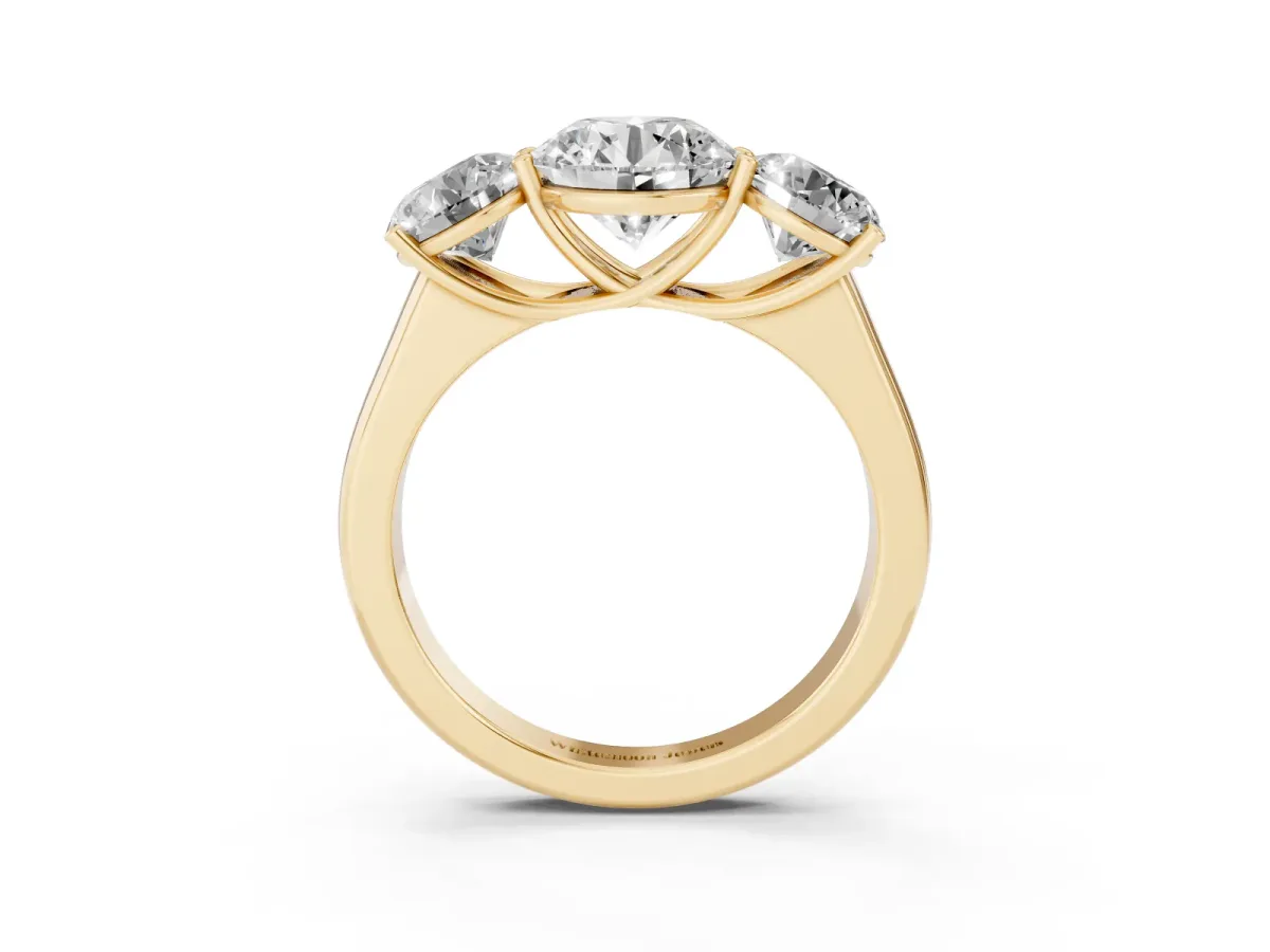 Round Cut Three-Stone Diamond Ring with Prong Setting on a Classic Band Yellow gold