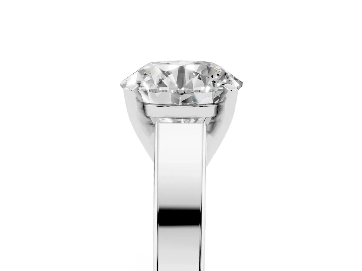 Round Cut Solitaire Engagement Ring with Four-Prong Setting and Tapered Band White gold