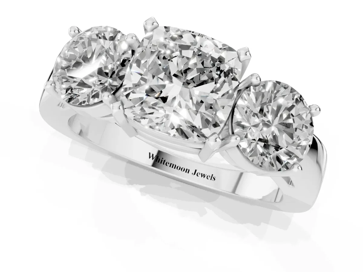 Three-Stone Cushion Cut Diamond Ring with Round Side Stones, Classic Band, and Four-Prong Setting Silver