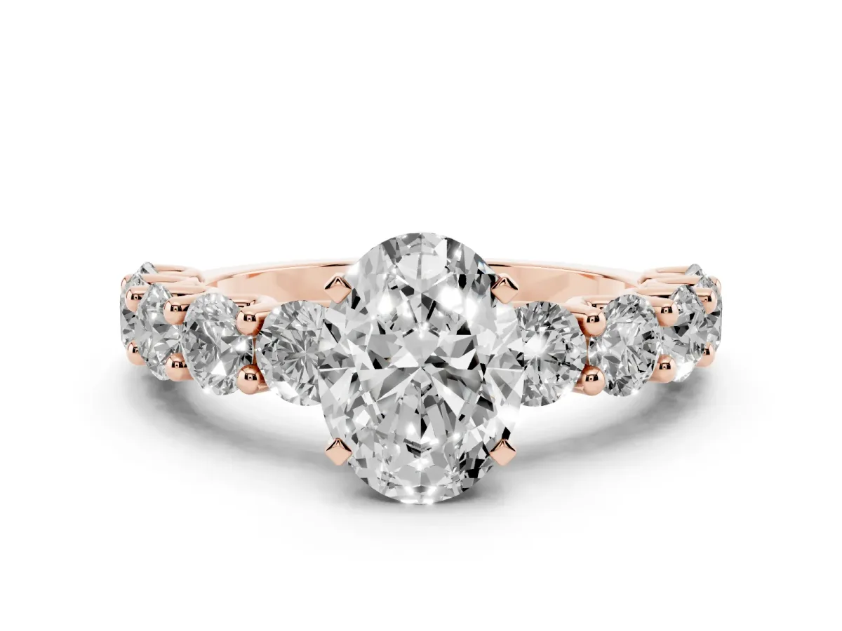 Oval Cut Diamond Prong Setting with Side Stones on a Pave Band Rose gold