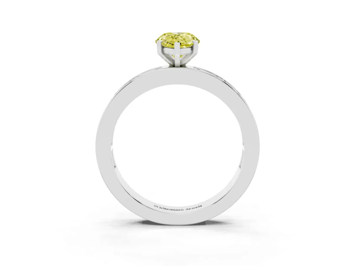 Fancy Yellow Pear Cut Solitaire Diamond Ring with Channel-Set Baguette Band and Four-Prong Setting Silver