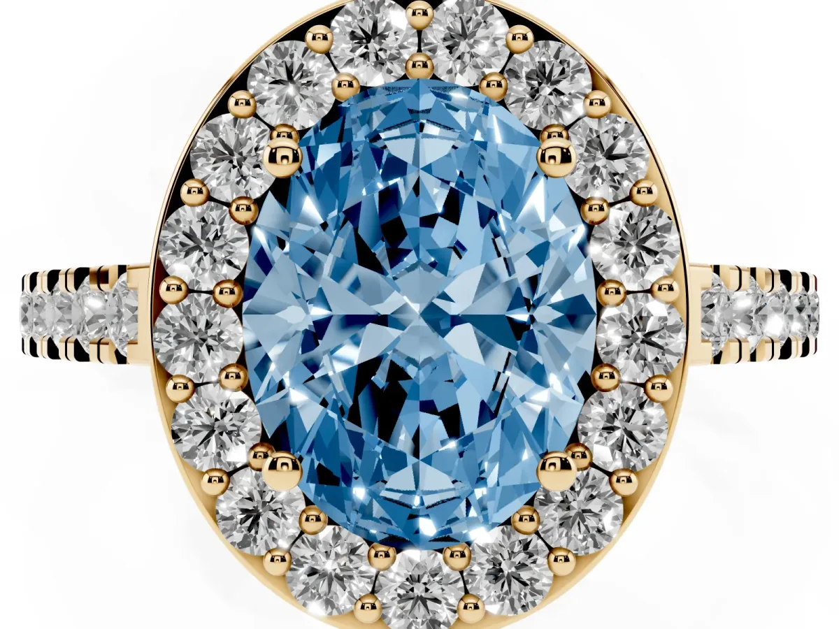 Fancy Blue Oval Cut Diamond Halo Ring with Round Pavé Split Shank and Prong Setting Yellow gold