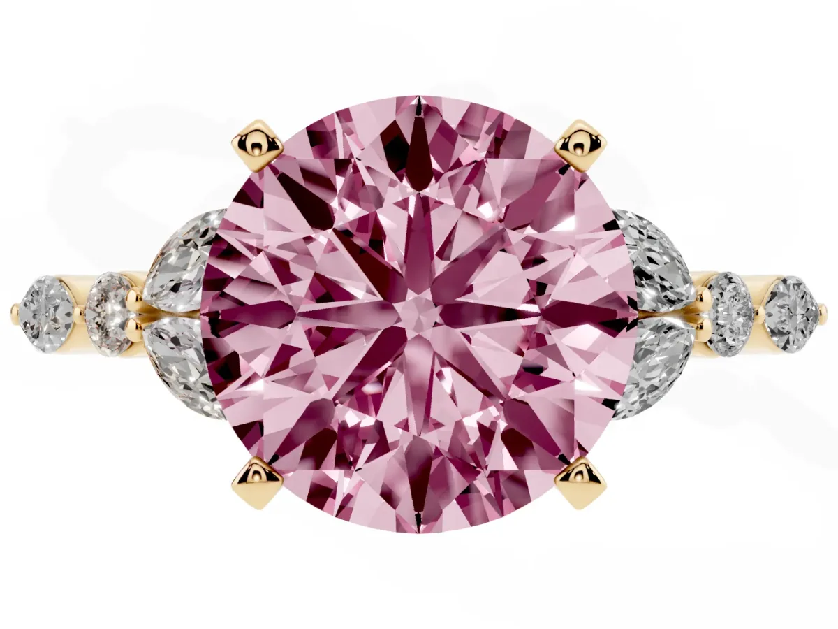 Fancy Pink Round Cut Diamond Solitaire Ring with Side Stones and Four-Prong Setting Yellow gold