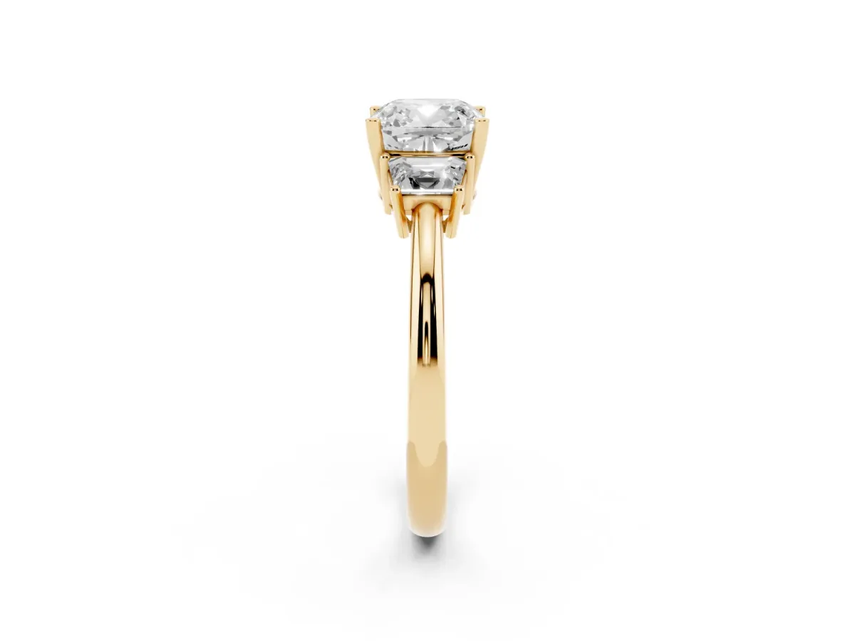 Cushion Cut Diamond Three-Stone Ring with Trapezoid Side Stones and Prong Setting Yellow gold