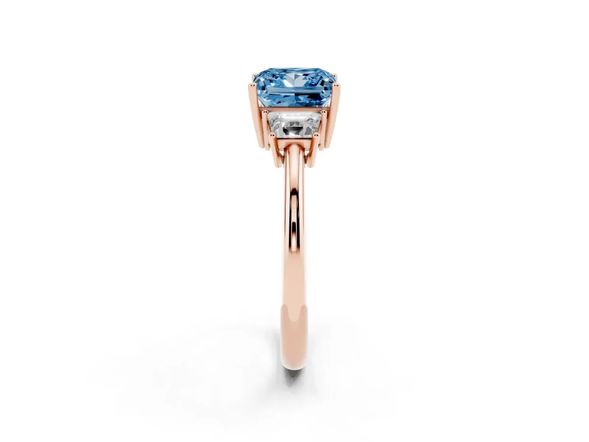 Fancy Blue Princess Cut Diamond Three-Stone Ring with Trapezoid Side Stones and Prong Setting Rose gold