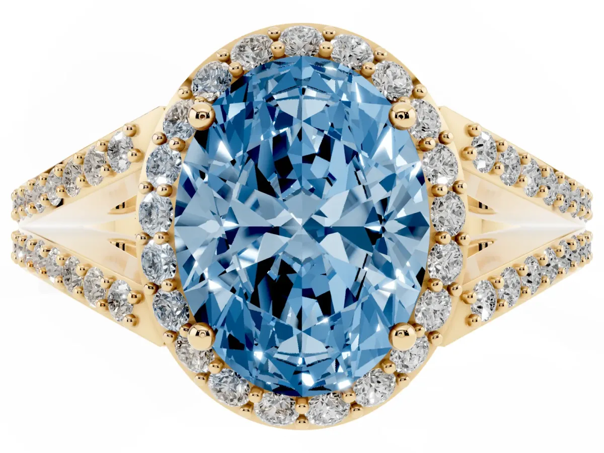 Fancy Blue Oval Cut Halo Split Shank Pave Diamond Ring with Four-Prong Setting Yellow gold