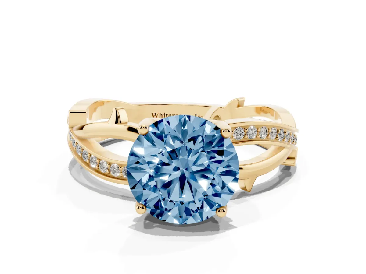 Fancy Blue Round Cut Solitaire Twist Band with Pavé Accents and Four-Prong Setting Yellow gold