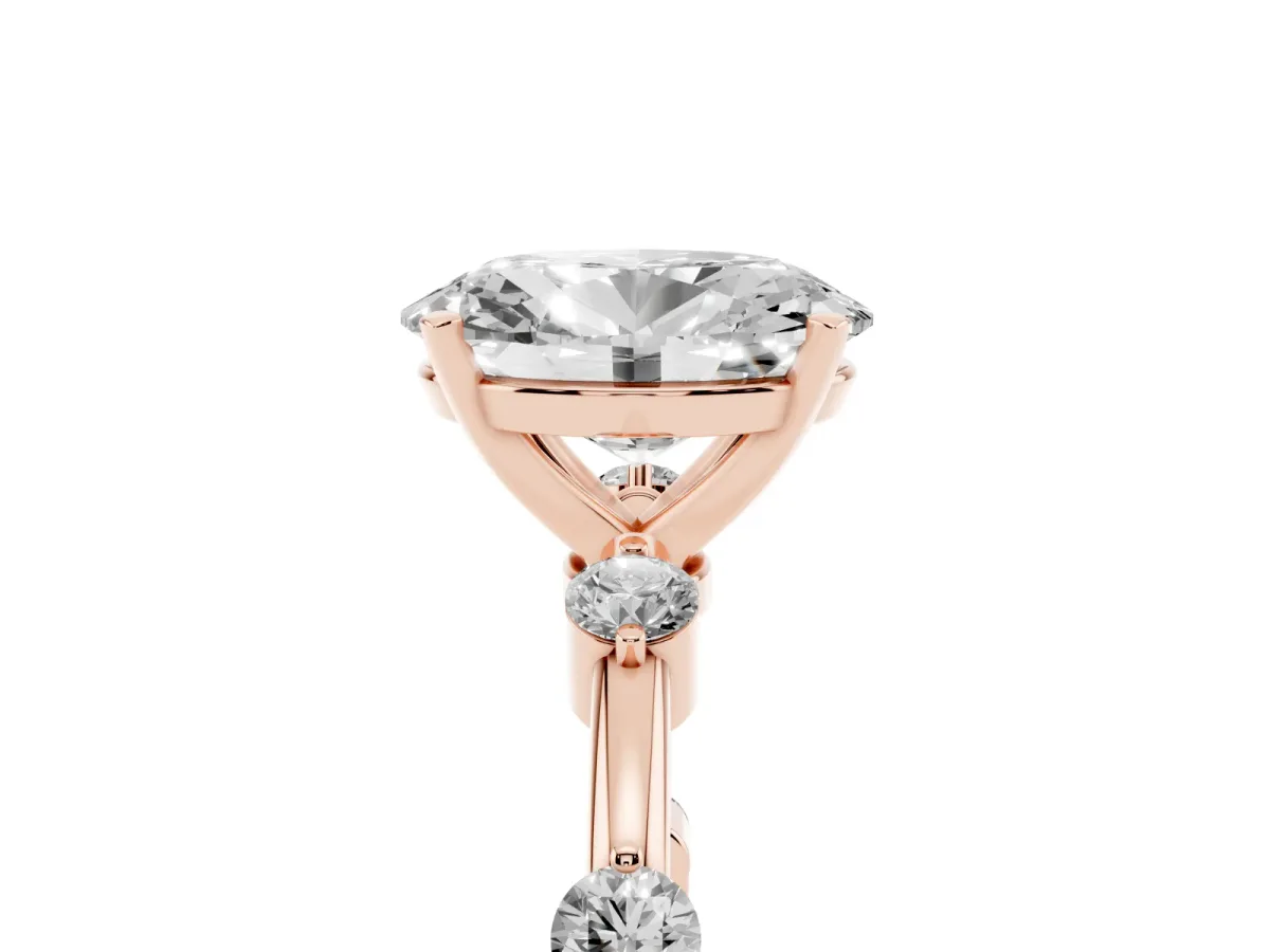 Oval Cut Solitaire Diamond Ring with Bezel Set Side Stones and Prong Setting Rose gold