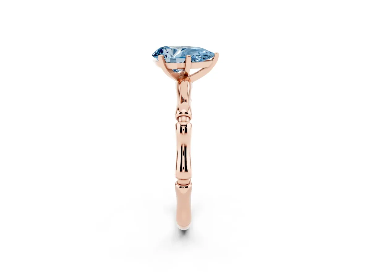 Fancy Blue Pear Cut Solitaire Diamond Ring with Bamboo Band and Four-Prong Setting Rose gold