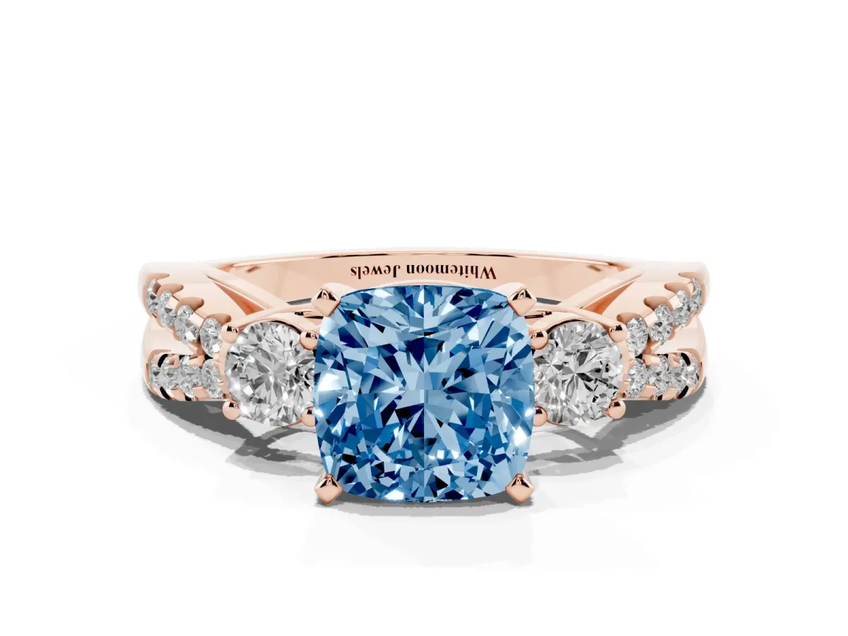 Fancy Blue Cushion Cut Diamond Three-Stone Ring with Pavé Split Shank and Four-Prong Setting Rose gold