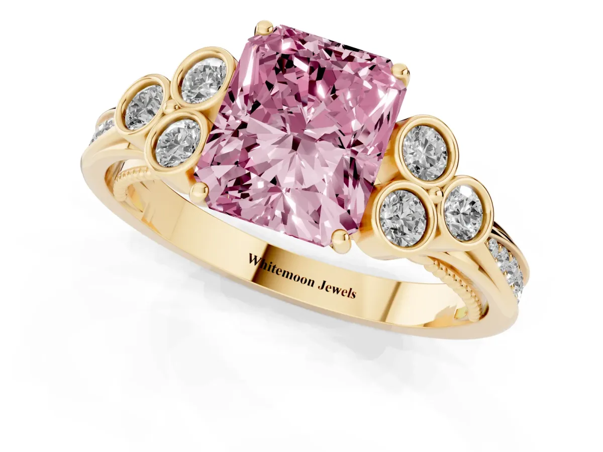Fancy Pink Radiant Cut Cut Diamond Engagement Ring with Bezel Set Round Side Stones and Prong Setting Yellow gold