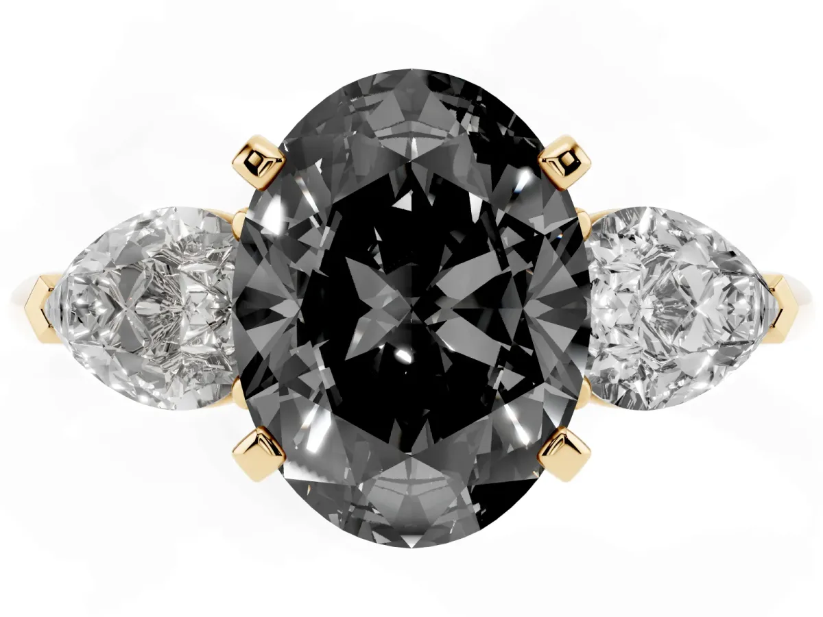 Fancy Black Three-Stone Oval Cut Diamond Ring with Pear Side Stones and Four-Prong Setting Yellow gold
