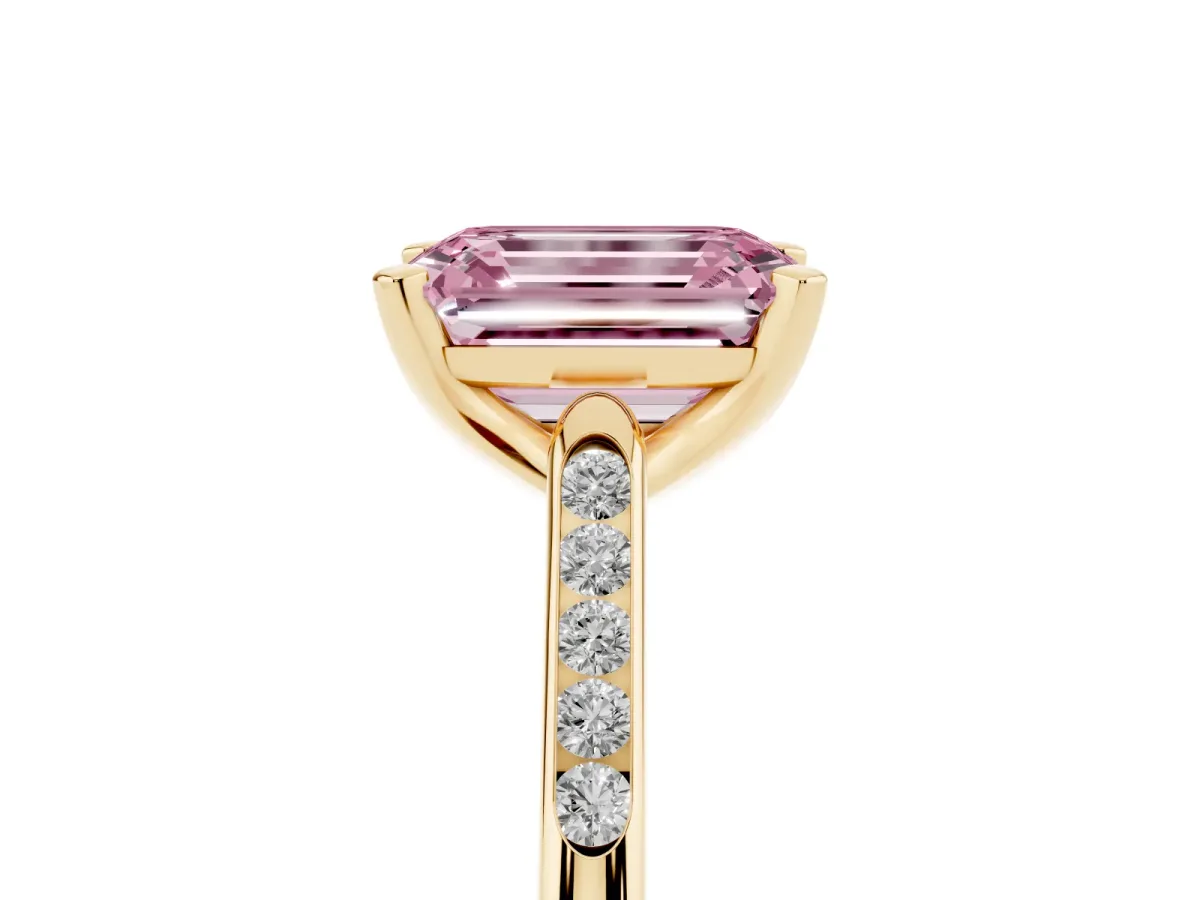 Fancy Pink Emerald Cut Diamond Solitaire Ring with Channel Set Round Band and Prong Setting Yellow gold