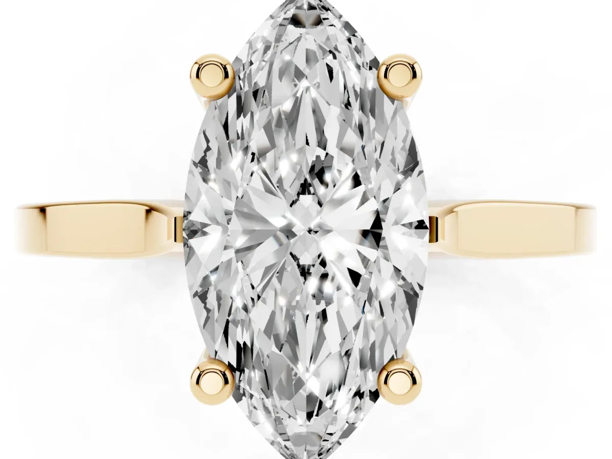 Marquise Cut Solitaire Diamond Ring with Four-Prong Setting and Tapered Band Yellow gold