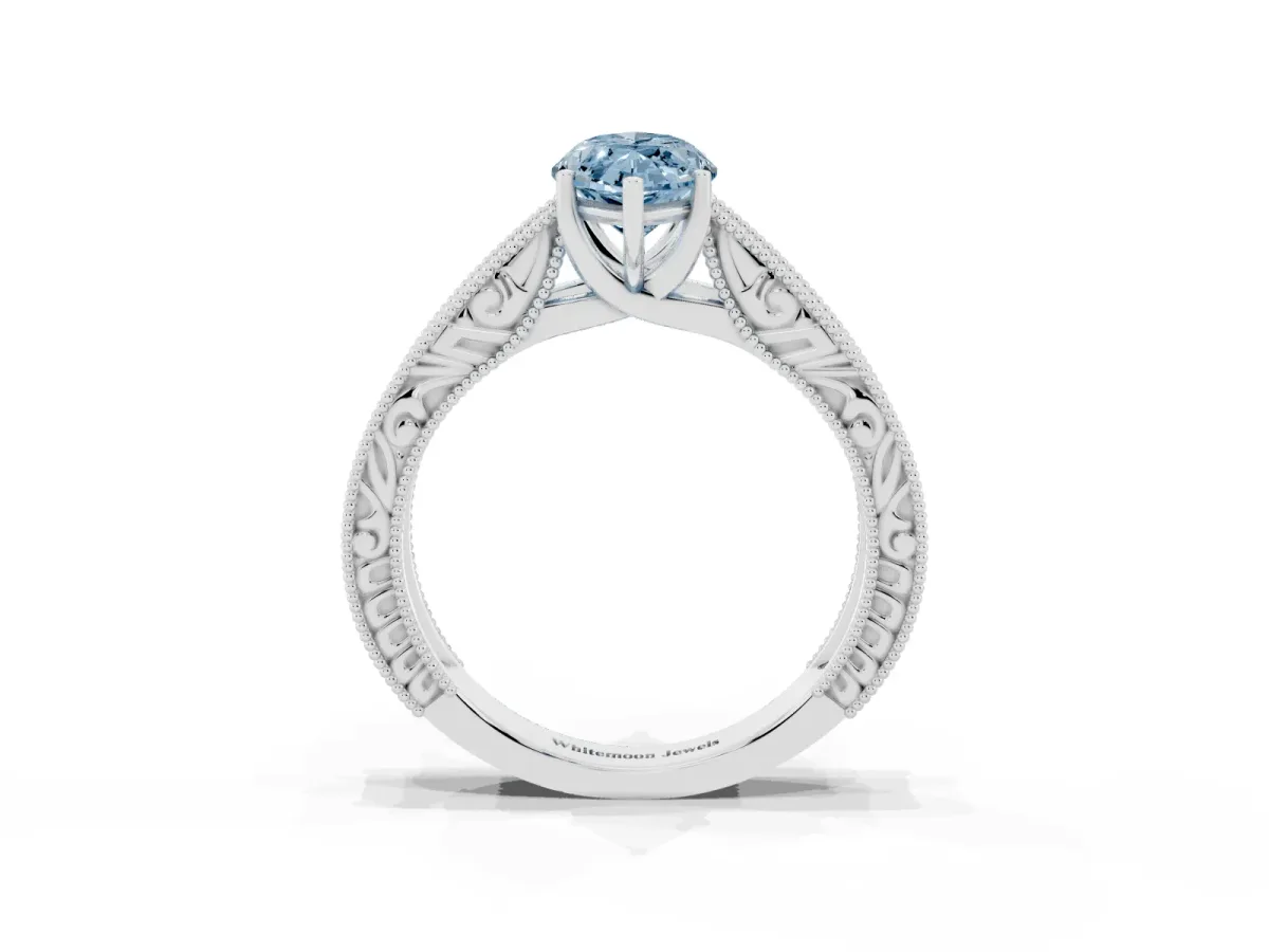 Fancy Blue Marquise Cut Diamond Solitaire Ring with Engraved Band and Four-Prong Setting White gold