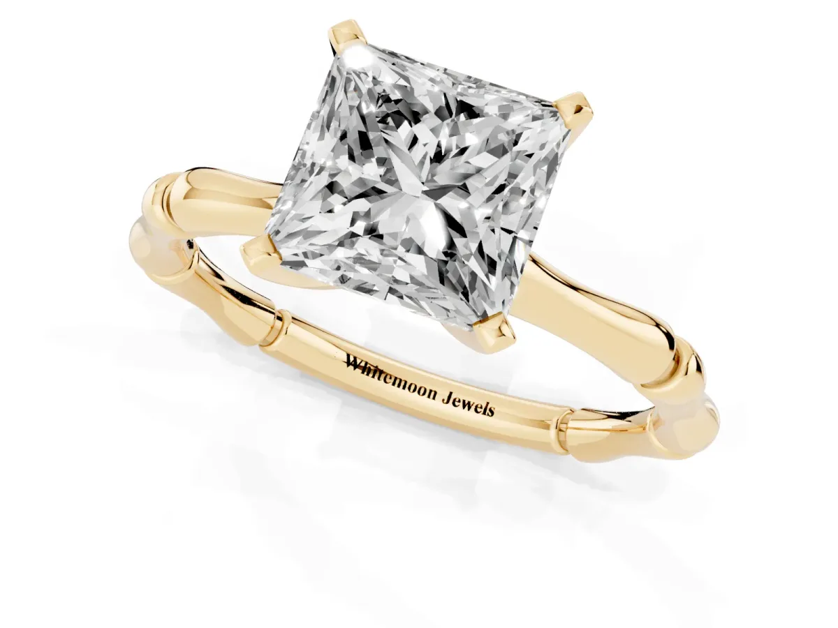 Princess Cut Solitaire Diamond Ring with Bamboo Band and Four-Prong Setting Yellow gold