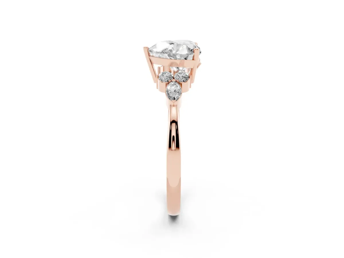 Heart Cut Brilliant Diamond Solitaire Ring with Pear Side Stones and Four-Prong Setting Rose gold