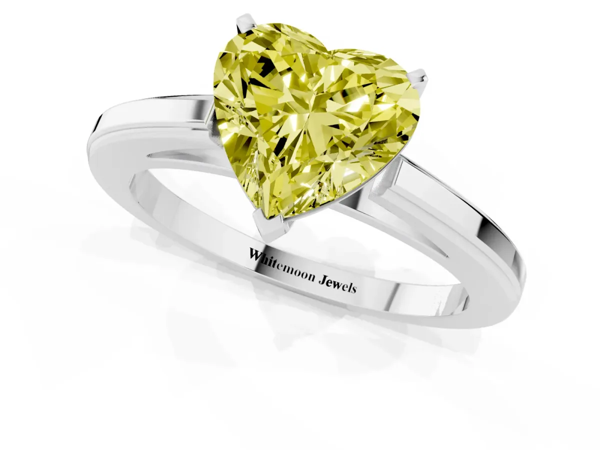 Fancy Yellow Heart Cut Solitaire Diamond Ring with Four-Prong Setting and Classic Band Silver