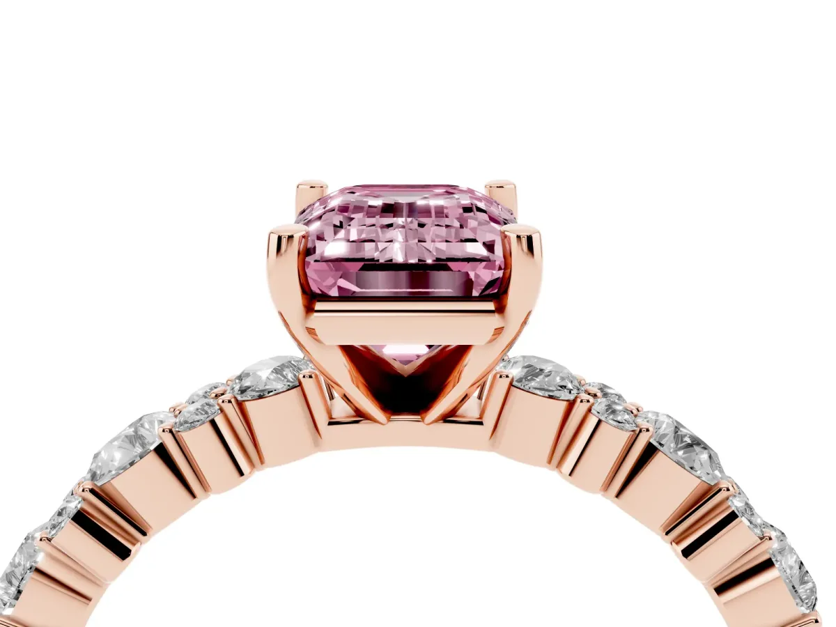 Fancy Pink Emerald Cut Diamond Side Stone Solitaire Ring with Round and Four-Prong Setting Rose gold