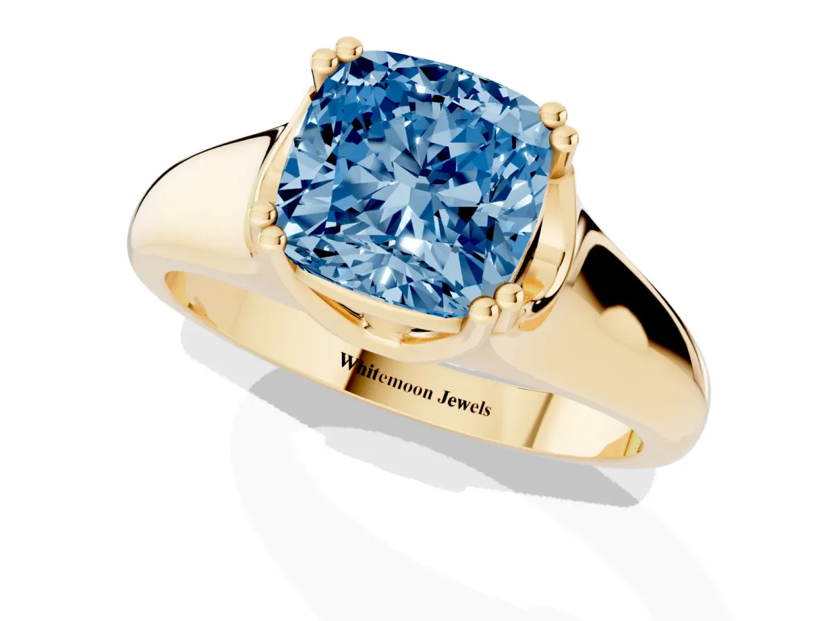 Fancy Blue Cushion Cut Diamond Solitaire Ring with Wide Band and Prong Setting Yellow gold