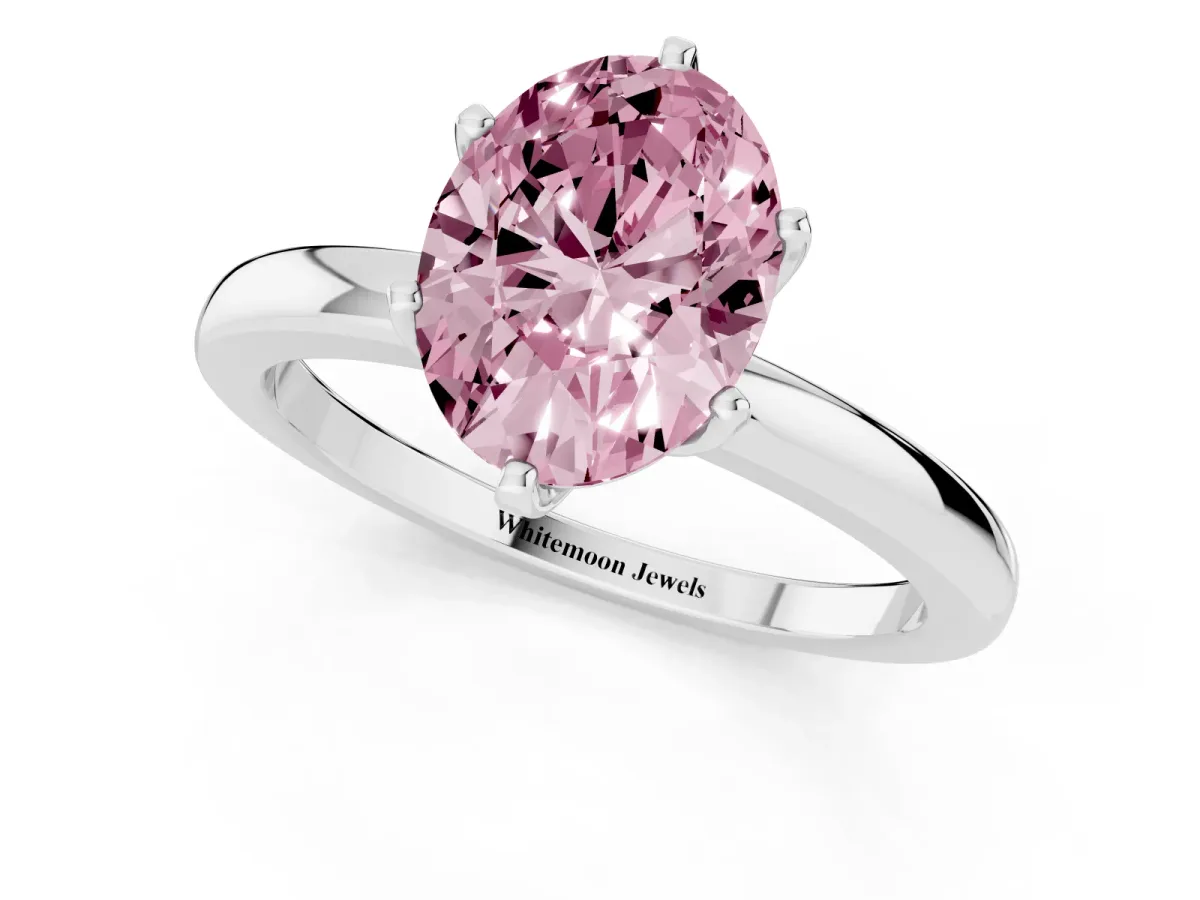 Fancy Pink Oval Cut Solitaire Diamond Ring with Six-Prong Setting on a Classic Band Silver