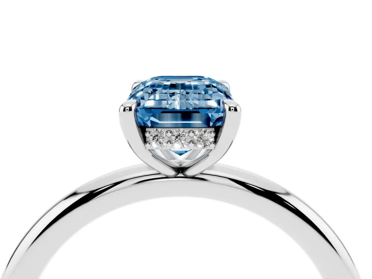 Fancy Blue Emerald Cut Diamond Solitaire Ring with Thin Band and Four-Prong Setting Silver