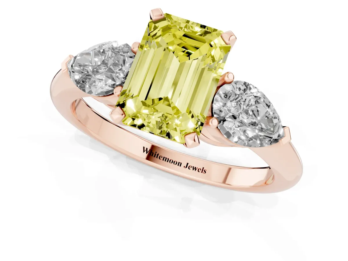 Fancy Yellow Three-Stone Emerald Cut Diamond Ring with Pear Side Stones and Four-Prong Setting Rose gold