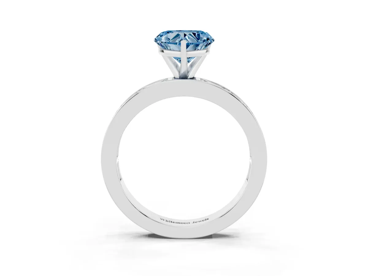 Fancy Blue Heart Cut Solitaire Diamond Ring with Channel-Set Baguette Band and Four-Prong Setting Platinum