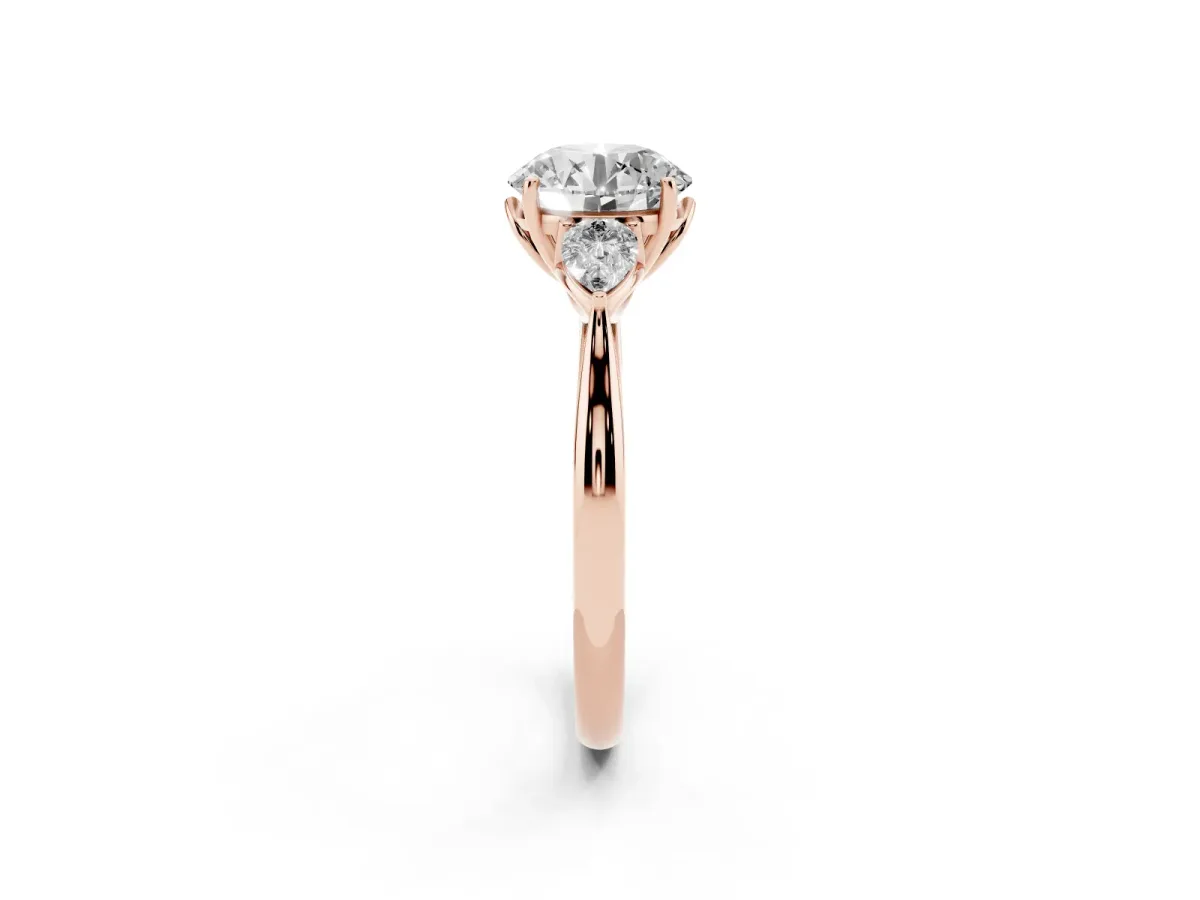 Round Cut Diamond Three-Stone Ring with Pear Side Stones and Prong Setting Rose gold