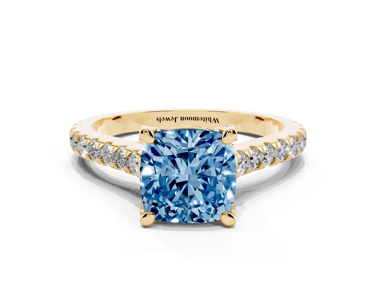 Fancy Blue Cushion Cut Brilliant Diamond Solitaire with Pavé Band and Four-Prong Setting Yellow gold