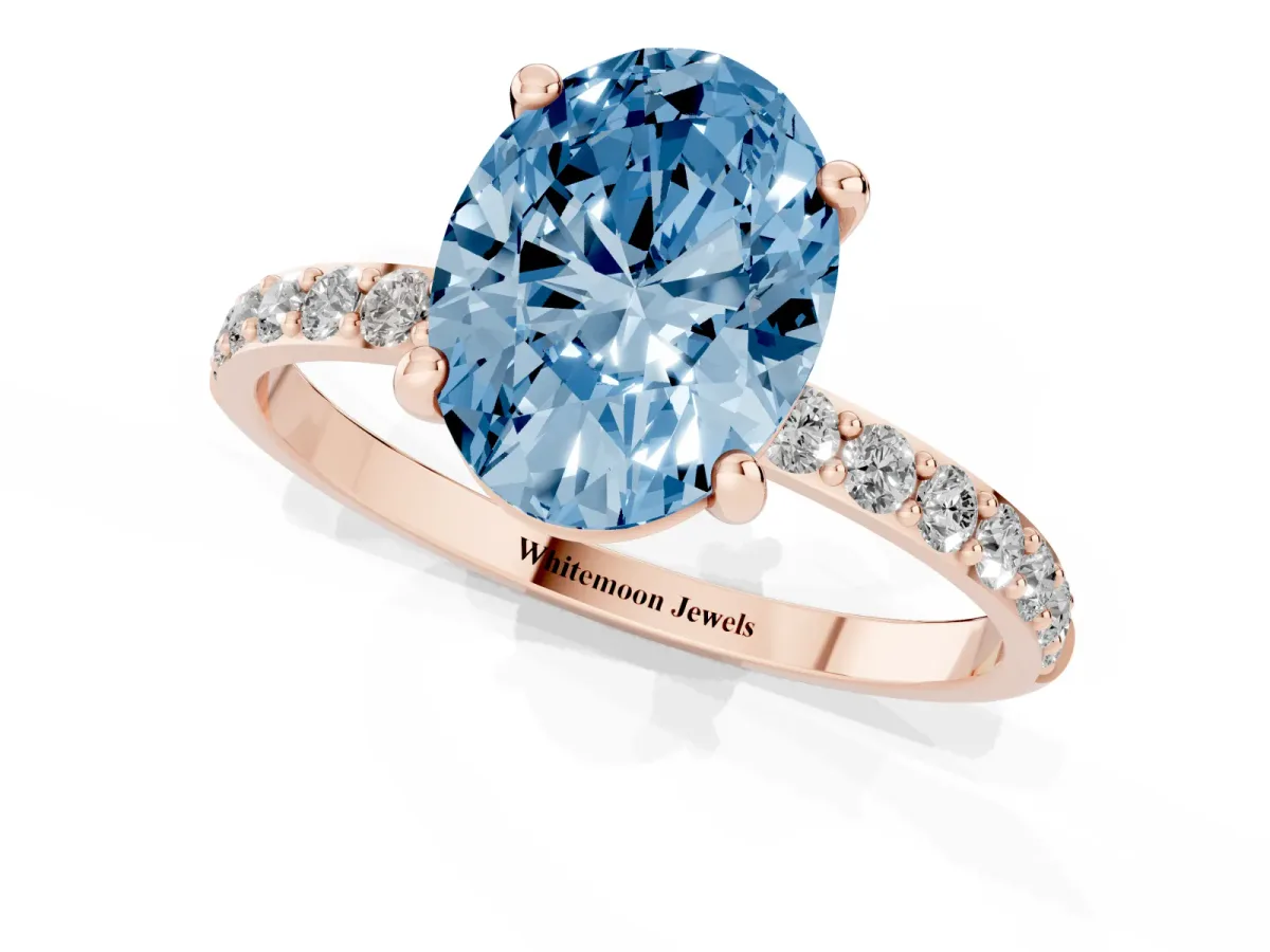Fancy Blue Oval Cut Diamond Solitaire Ring with Round Pavé Band and Prong Setting Rose gold