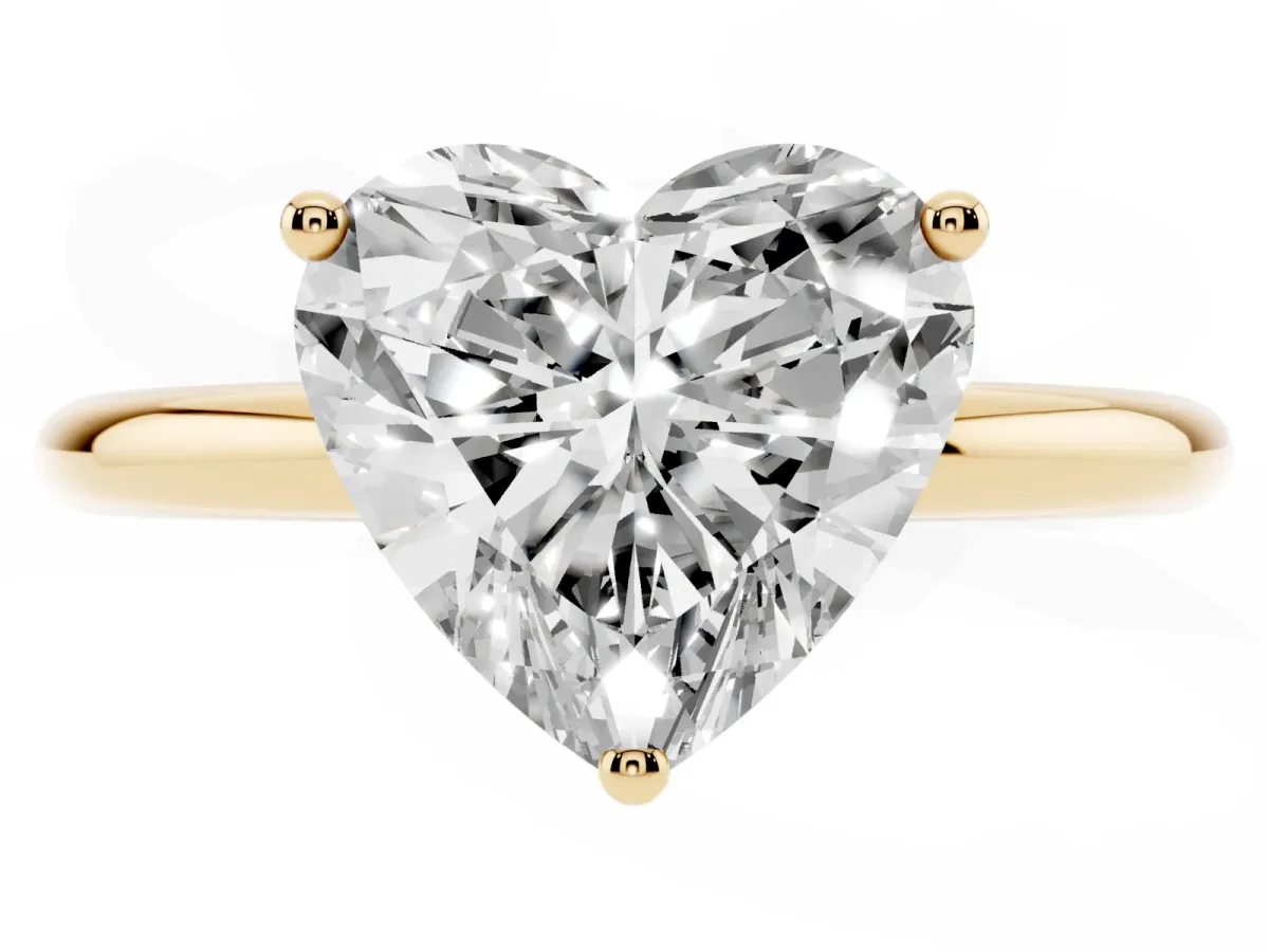 Heart Cut Cut Solitaire Engagement Ring with Four-Prong Setting and Classic Band Yellow gold